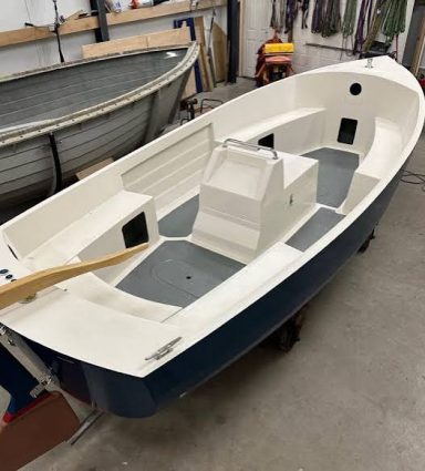 Aquasea launch interior with centre console and side seating, viewed from the stern